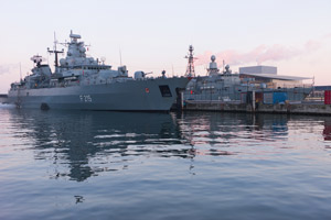 The German frigate F215 in a harbour.
