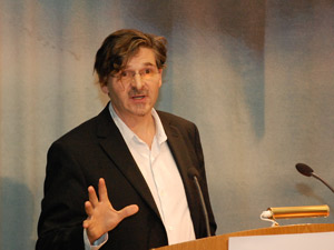 A man (Jan-Werner Müller) talking from a podium.