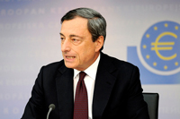 A man in a suit (Mario Draghi) sitting by a microphone.