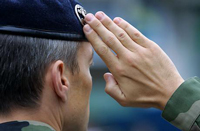 A military man doing a salute.
