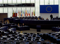 Inside the European Parliament. Desks in a circle.