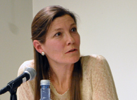A woman sitting in front of a microphone (Helene Sjursen).