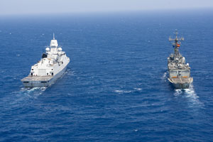 Two military ships on the ocean.