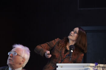 Glasses ,Microphone ,Coat ,Spokesperson ,Entertainment.