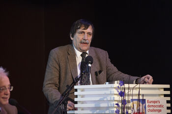 Microphone ,Tie ,Spokesperson ,Dress shirt ,Public address system.