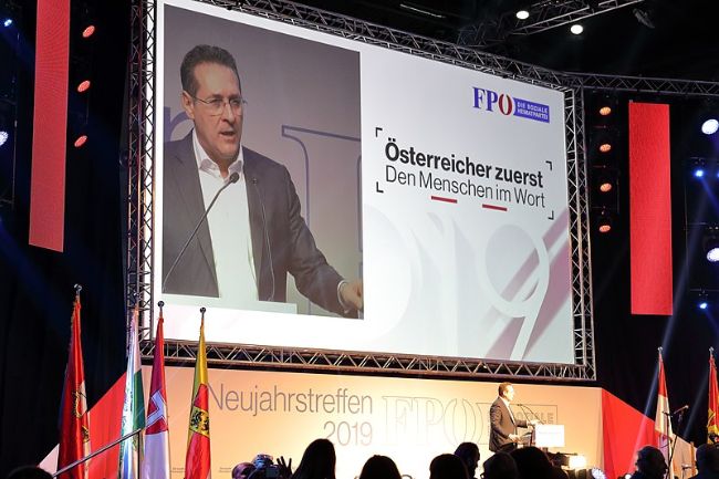 man giving a presentation on a stage
