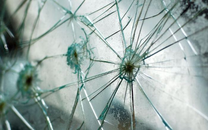 bullet holes in glass