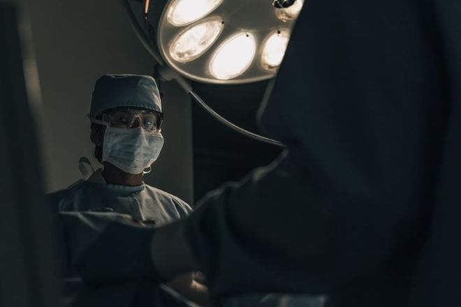 Surgeon with protective medical clothes