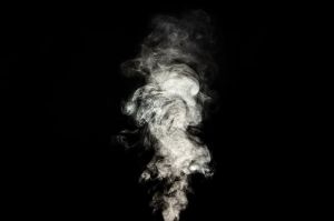 White smoke on black background