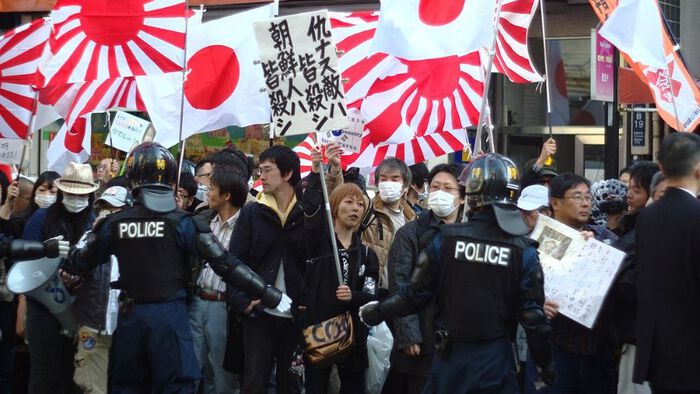 crowd and police in a protest