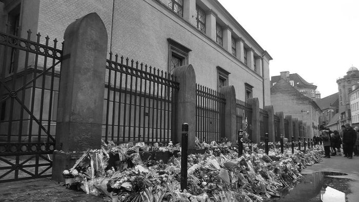 Flowers on the ground in front of a synagogue