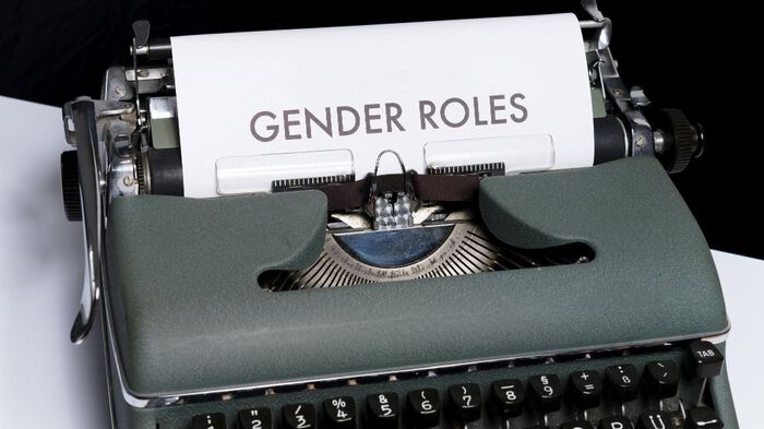 typwriter with the word "gender roles"