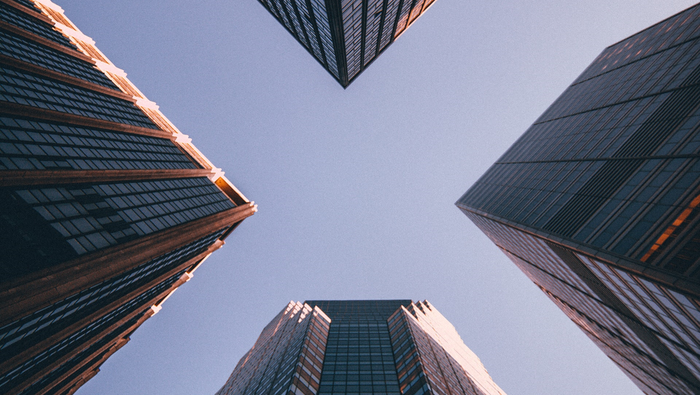 Low angle photograph of four high-rise buildings