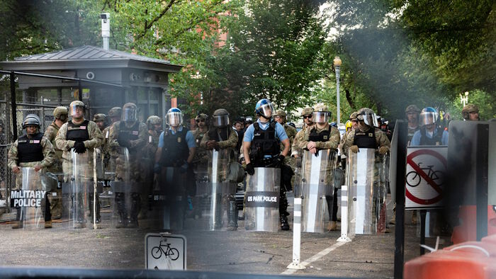 police with shields and helmets
