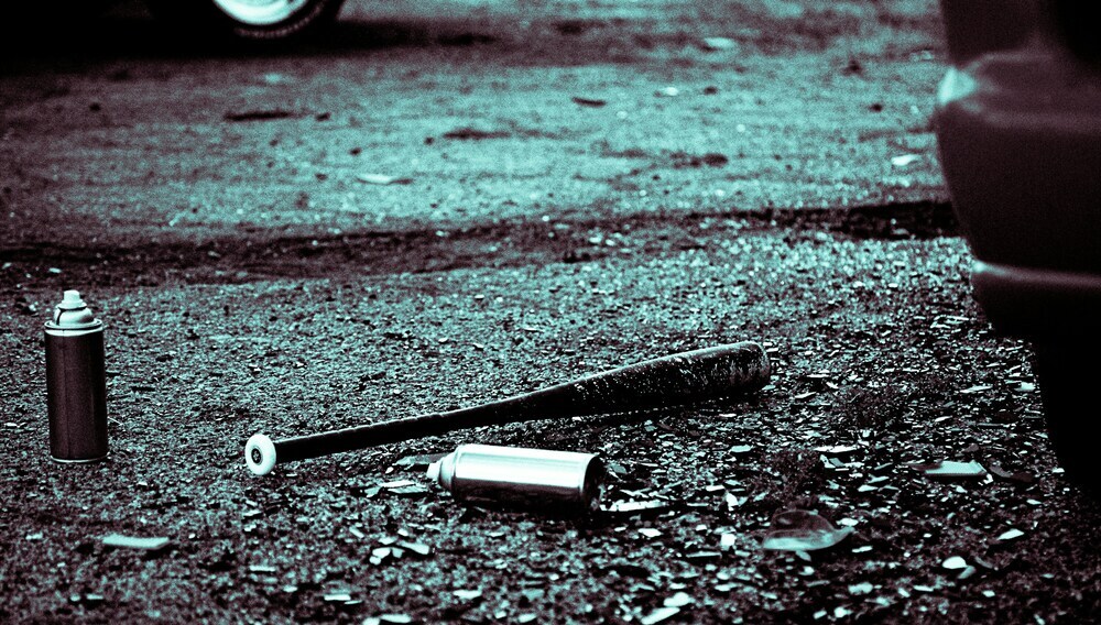 bat an spray cans on the ground