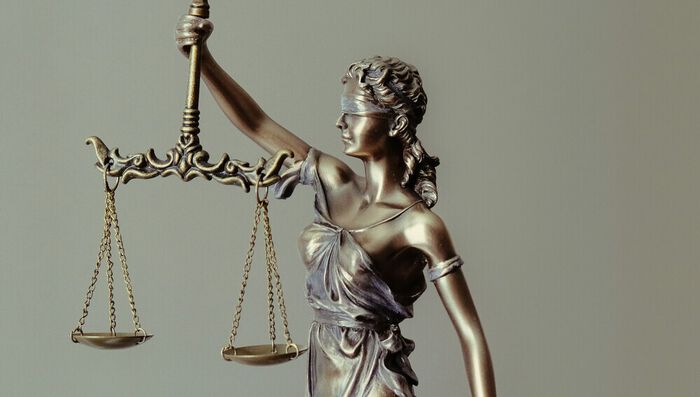 statue with a balance weight