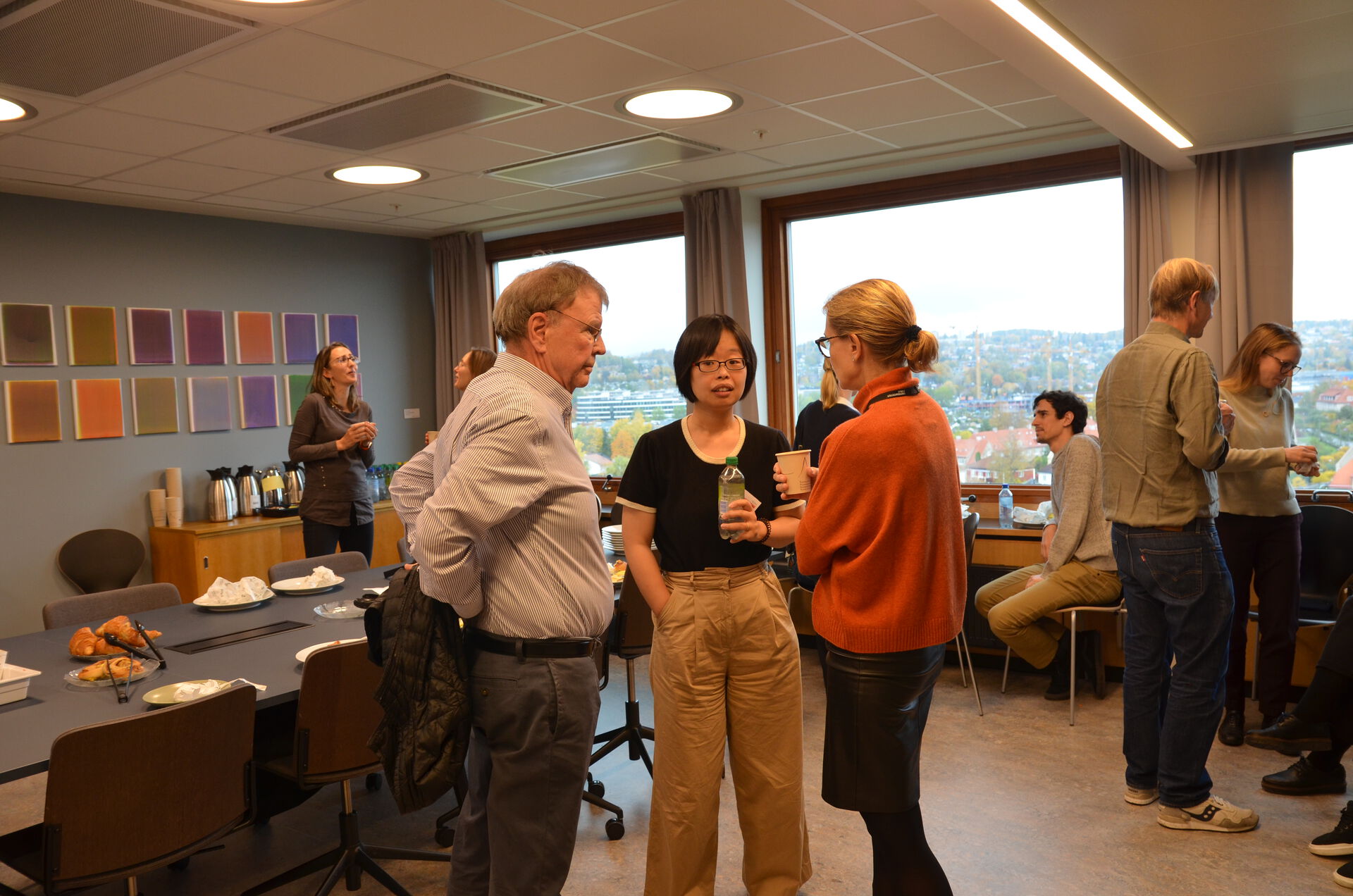 three people talking in a group