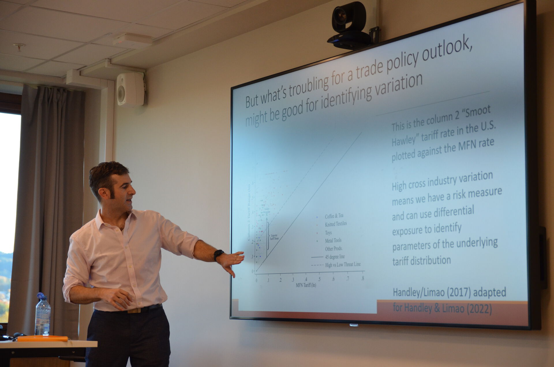 a man showing information on a screen