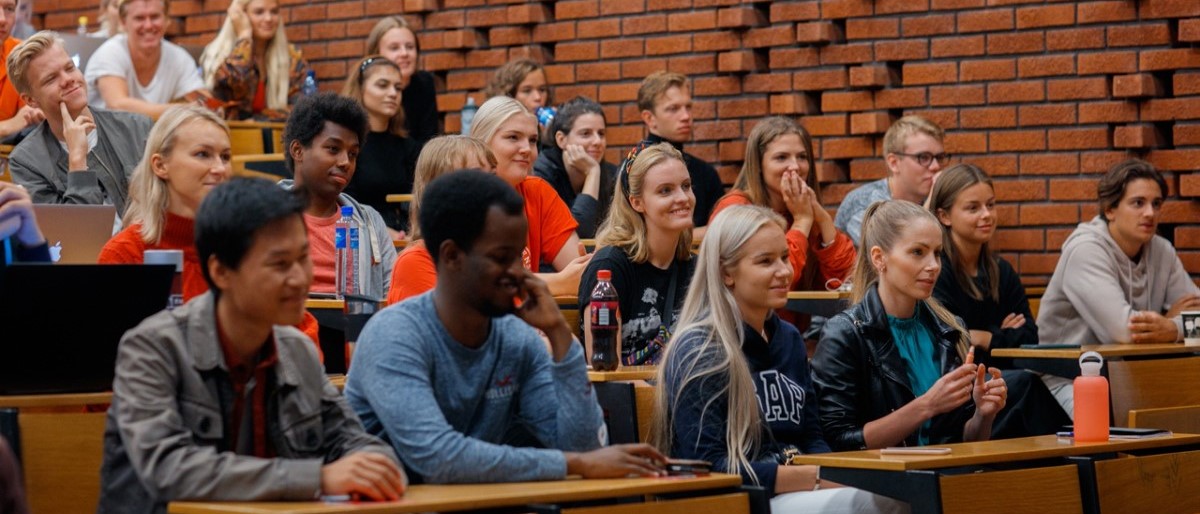 Students smiling during a lecture