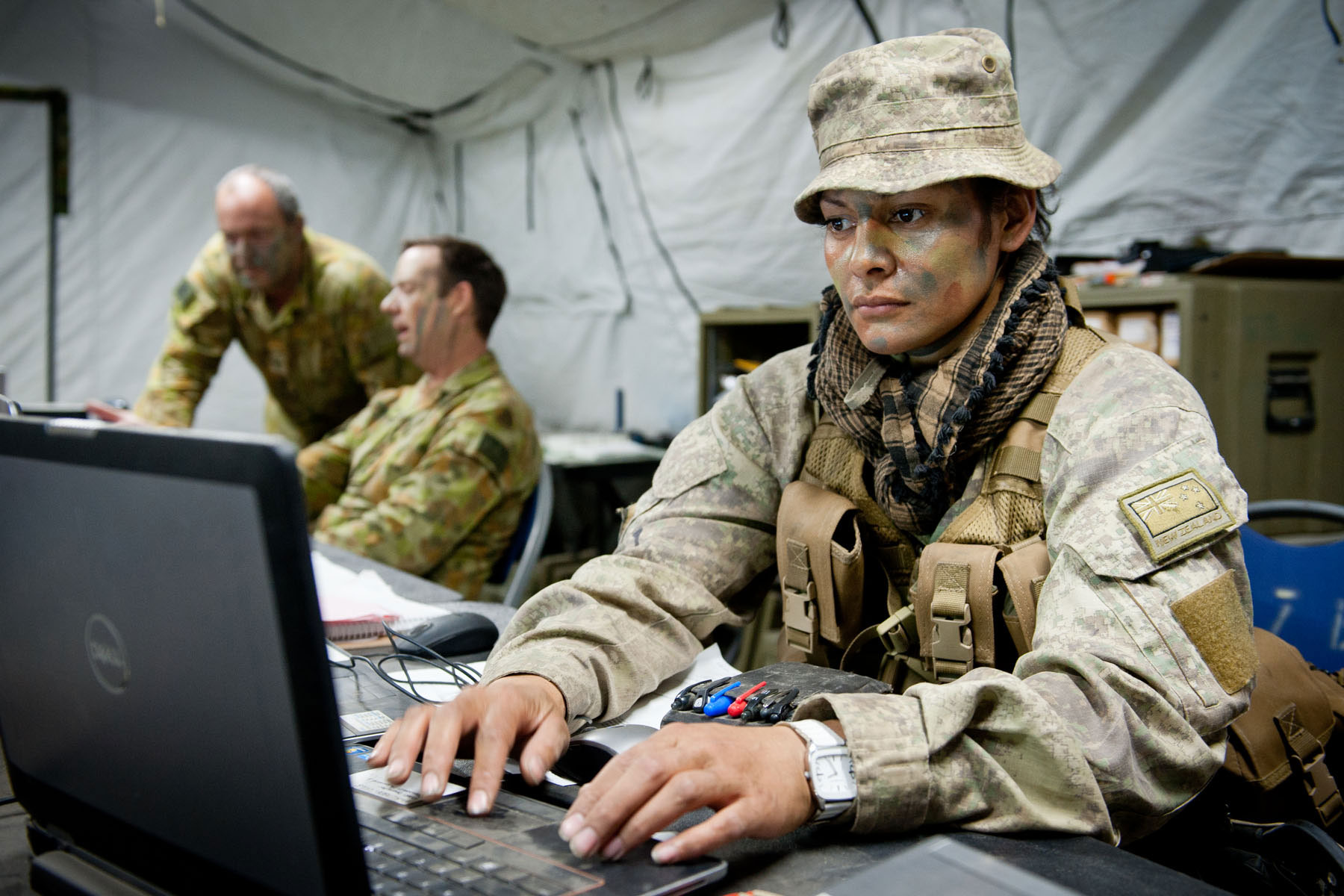 Ukraine soldier in front of computer