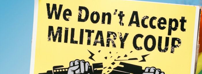 Poster from a demonstration, reading "we dont accept military coup"