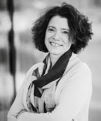 black and white photo of a smiling woman