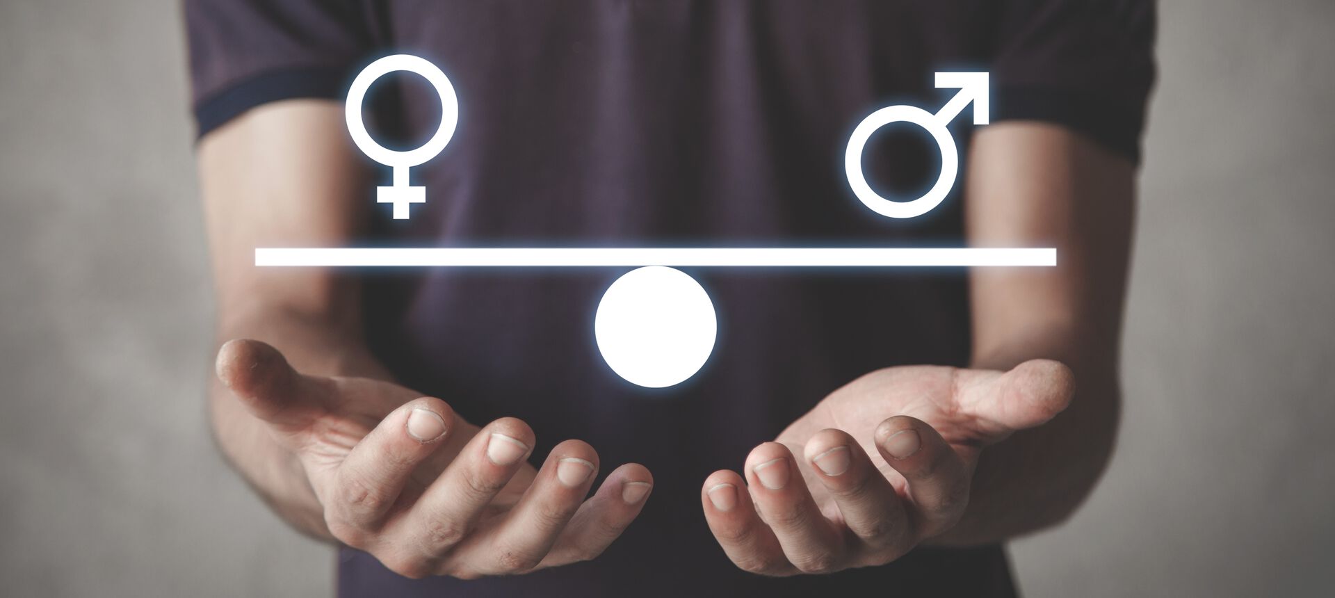 Illustration of hands holding a weighing scale with the symbol for the woman on one side and the man on the other side.