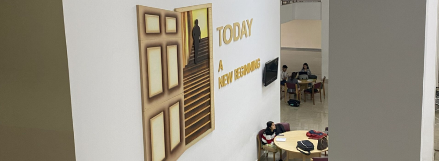 white walls, people sitter around a round table