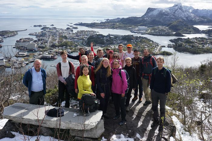 Group photo of the INTRANSIT team taken on a mountain top in Lofoten.